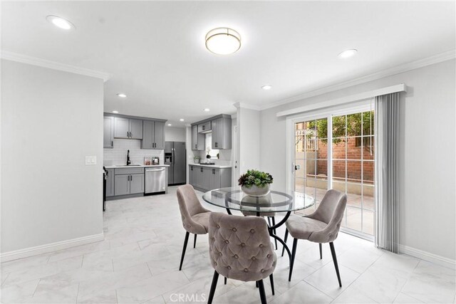 1960 Chariton St, Los Angeles, CA 90034 - dining space with light marble finish floors, baseboards, recessed lighting, and ornamental molding