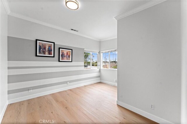 1960 Chariton St, Los Angeles, CA 90034 - empty room featuring baseboards, wood finished floors, and crown molding