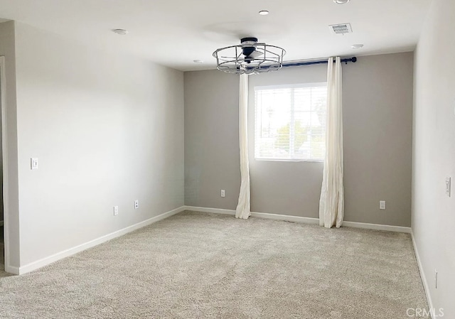 24927 Gulfstream Ln, Moreno Valley, CA 92553 - empty room with light colored carpet, baseboards, and a chandelier