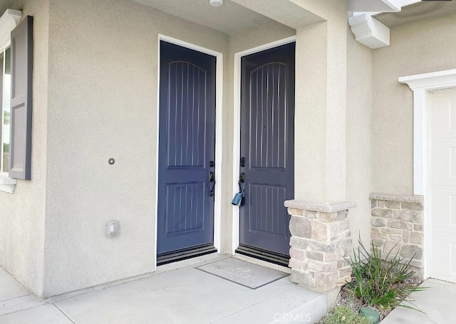 24927 Gulfstream Ln, Moreno Valley, CA 92553 - view of exterior entry with stucco siding and stone siding