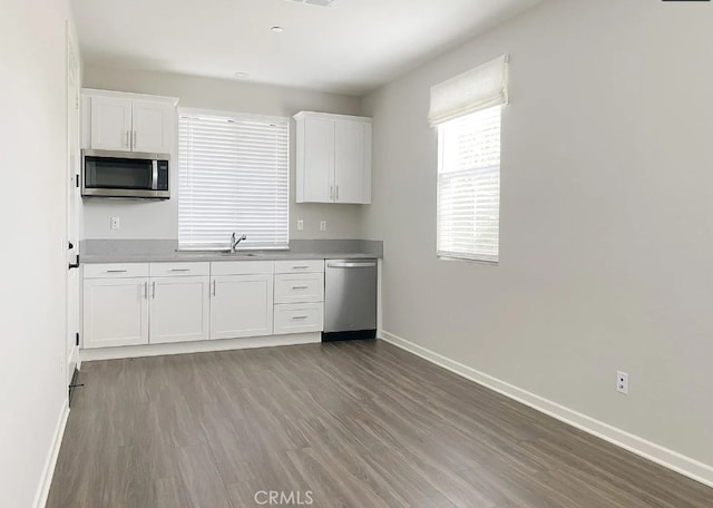 24927 Gulfstream Ln, Moreno Valley, CA 92553 - kitchen featuring appliances with stainless steel finishes, white cabinets, and baseboards