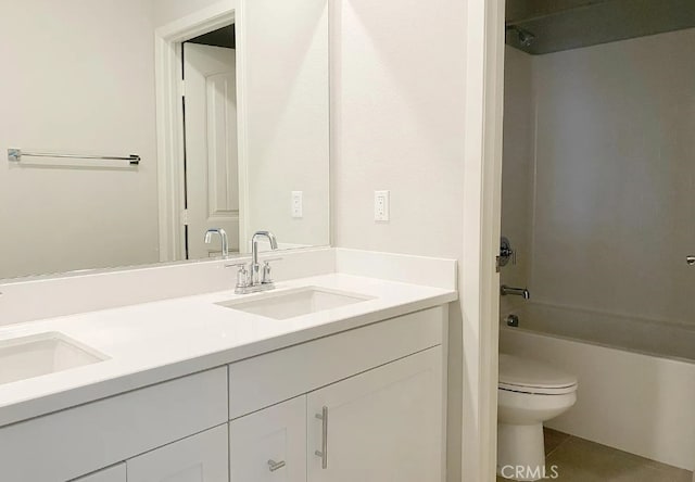 24927 Gulfstream Ln, Moreno Valley, CA 92553 - bathroom featuring double vanity, toilet, washtub / shower combination, and tile patterned floors