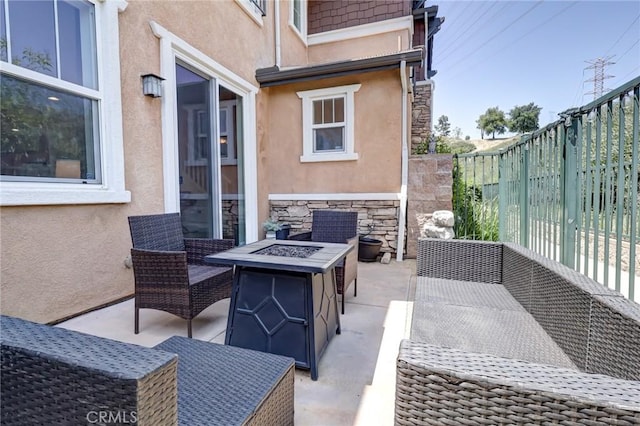 16710 Nicklaus Dr Unit 73, Rancho Cascades, CA 91342 - view of patio featuring an outdoor fire pit