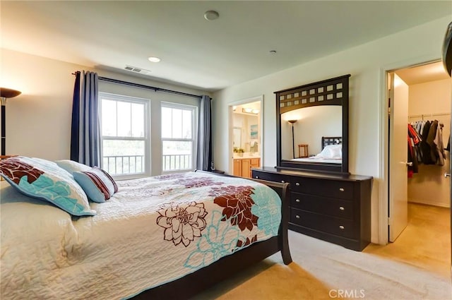 16710 Nicklaus Dr Unit 73, Rancho Cascades, CA 91342 - bedroom featuring a walk in closet, a closet, light colored carpet, and ensuite bath