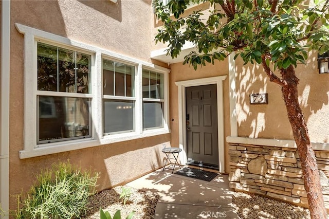 16710 Nicklaus Dr Unit 73, Rancho Cascades, CA 91342 - doorway to property featuring stucco siding