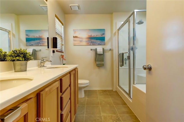 16710 Nicklaus Dr Unit 73, Rancho Cascades, CA 91342 - full bathroom featuring a shower stall, double vanity, toilet, tile patterned floors, and baseboards