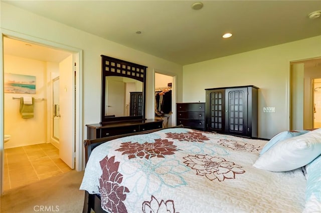 16710 Nicklaus Dr Unit 73, Rancho Cascades, CA 91342 - tiled bedroom featuring a spacious closet, ensuite bath, recessed lighting, and a closet