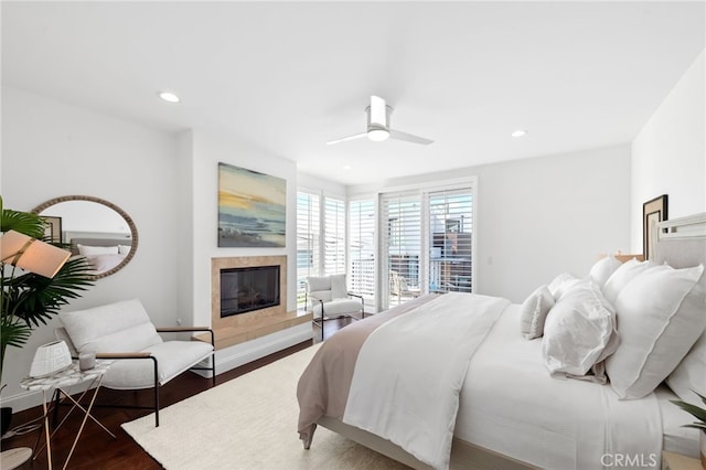 420 34th St, Manhattan Beach, CA 90266 - bedroom featuring wood finished floors, a glass covered fireplace, recessed lighting, and a ceiling fan