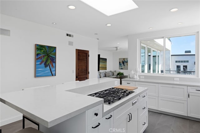 420 34th St, Manhattan Beach, CA 90266 - kitchen featuring light countertops, recessed lighting, stainless steel gas cooktop, white cabinets, and light marble finish flooring