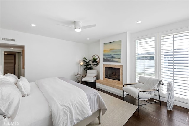 420 34th St, Manhattan Beach, CA 90266 - bedroom featuring dark wood-style flooring, recessed lighting, a tiled fireplace, and ceiling fan