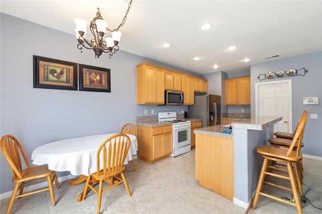 26146 Deer Run St, Menifee, CA 92584 - kitchen featuring stainless steel appliances, a chandelier, light countertops, baseboards, and recessed lighting