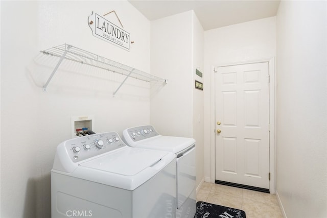 26146 Deer Run St, Menifee, CA 92584 - washroom featuring washer and clothes dryer, baseboards, and light tile patterned floors