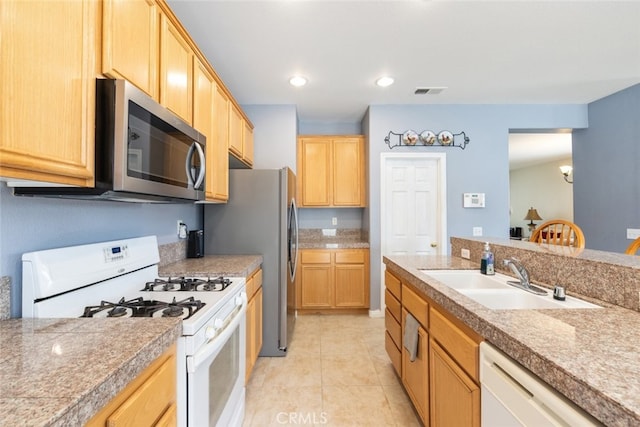 26146 Deer Run St, Menifee, CA 92584 - kitchen featuring stainless steel appliances, a sink, light brown cabinets, light tile patterned flooring, and tile countertops