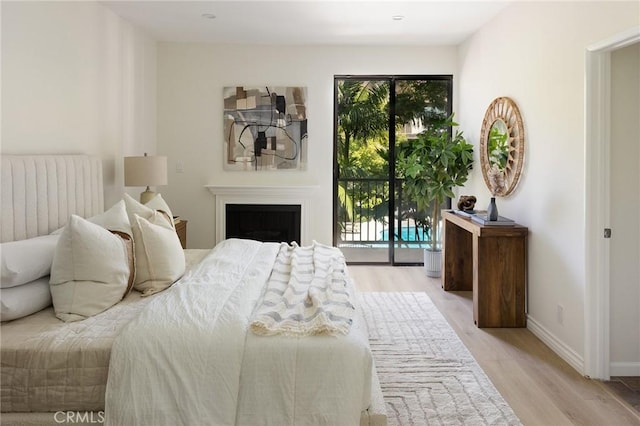 330 Cordova St Unit 322, Pasadena, CA 91101 - bedroom featuring multiple windows, access to outside, and light wood-type flooring