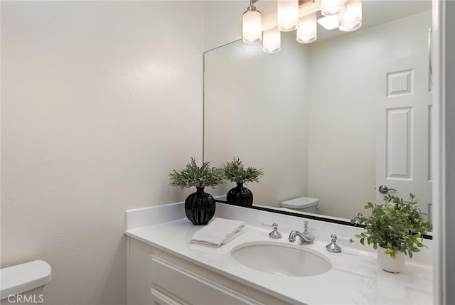 330 Cordova St Unit 322, Pasadena, CA 91101 - bathroom with toilet, vanity, and a chandelier