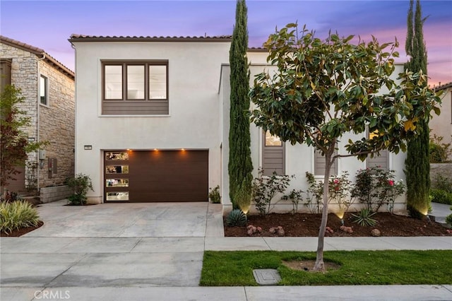 56 Claudius Ct, Irvine, CA 92618 - view of front of home with stucco siding, concrete driveway, and a garage