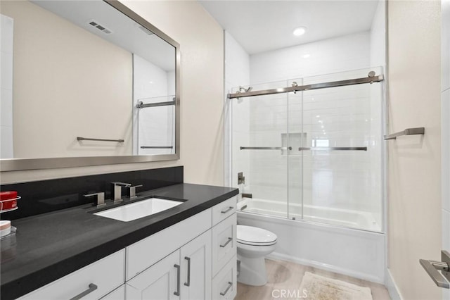 56 Claudius Ct, Irvine, CA 92618 - bathroom featuring toilet, vanity, combined bath / shower with glass door, and recessed lighting