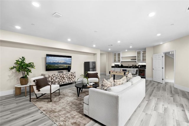 56 Claudius Ct, Irvine, CA 92618 - living room featuring light wood-style flooring, recessed lighting, and baseboards