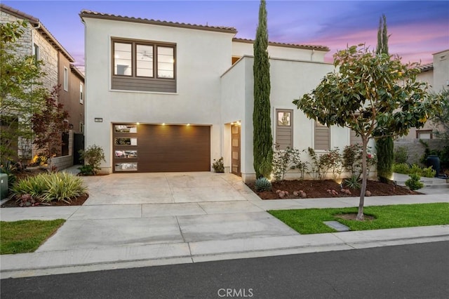 56 Claudius Ct, Irvine, CA 92618 - mediterranean / spanish-style home with driveway, an attached garage, stucco siding, and a tiled roof