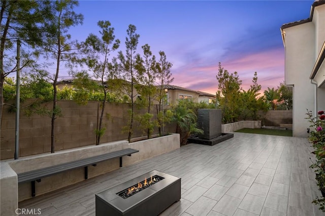 56 Claudius Ct, Irvine, CA 92618 - fenced backyard featuring an outdoor fire pit and a patio