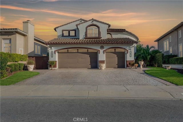 668 Corte Sol, Camarillo, CA 93010 - mediterranean / spanish house featuring decorative driveway, stucco siding, a garage, and a tiled roof