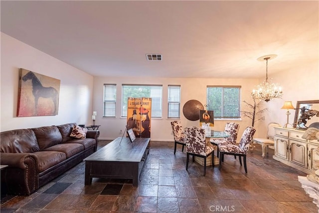668 Corte Sol, Camarillo, CA 93010 - living area featuring stone tile flooring, a chandelier, and baseboards