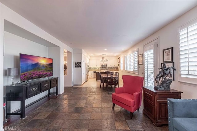 668 Corte Sol, Camarillo, CA 93010 - living room with dark stone finish flooring, baseboards, and recessed lighting