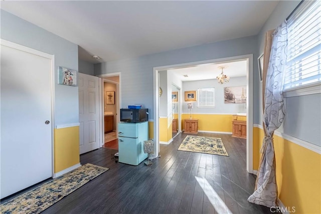 668 Corte Sol, Camarillo, CA 93010 - bedroom with multiple windows, dark wood-type flooring, baseboards, and a chandelier