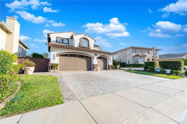668 Corte Sol, Camarillo, CA 93010 - mediterranean / spanish-style house with decorative driveway, stucco siding, a tile roof, and a front lawn