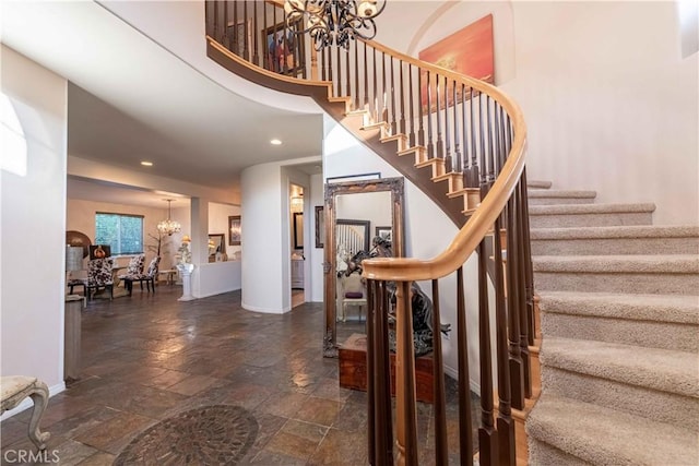 668 Corte Sol, Camarillo, CA 93010 - stairs featuring a chandelier, stone tile flooring, baseboards, recessed lighting, and a high ceiling