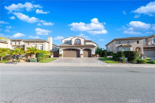 668 Corte Sol, Camarillo, CA 93010 - mediterranean / spanish-style home featuring driveway, a garage, a residential view, and a tiled roof