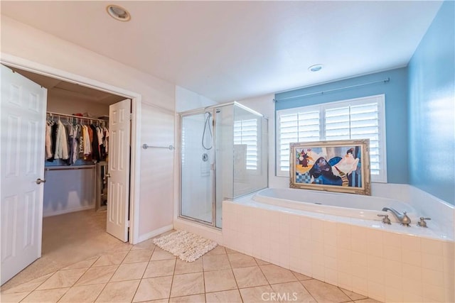668 Corte Sol, Camarillo, CA 93010 - full bathroom with a bath, a stall shower, a walk in closet, and tile patterned flooring