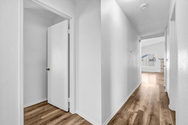 1036 W Gilman St, Banning, CA 92220 - hall featuring wood finished floors and baseboards