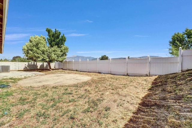 1036 W Gilman St, Banning, CA 92220 - fenced backyard with a mountain view and a patio