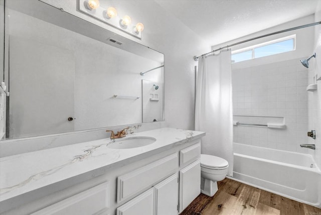 1036 W Gilman St, Banning, CA 92220 - bathroom with shower / bath combo, wood finished floors, and vanity
