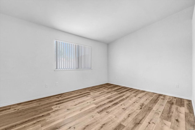 1036 W Gilman St, Banning, CA 92220 - spare room featuring wood finished floors and baseboards