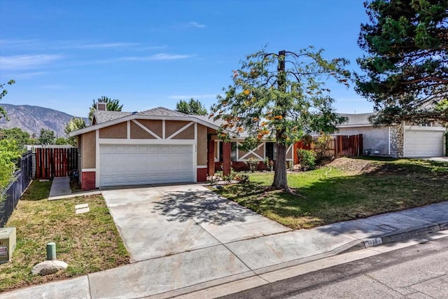 1036 W Gilman St, Banning, CA 92220 - view of front of home featuring a garage, stucco siding, concrete driveway, and brick siding