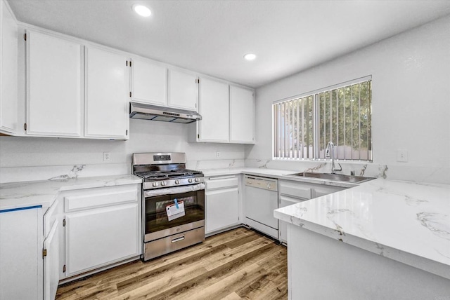 1036 W Gilman St, Banning, CA 92220 - kitchen featuring gas range, dishwasher, under cabinet range hood, white cabinets, and recessed lighting