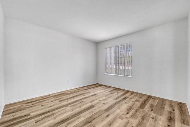 1036 W Gilman St, Banning, CA 92220 - unfurnished room featuring wood finished floors and baseboards