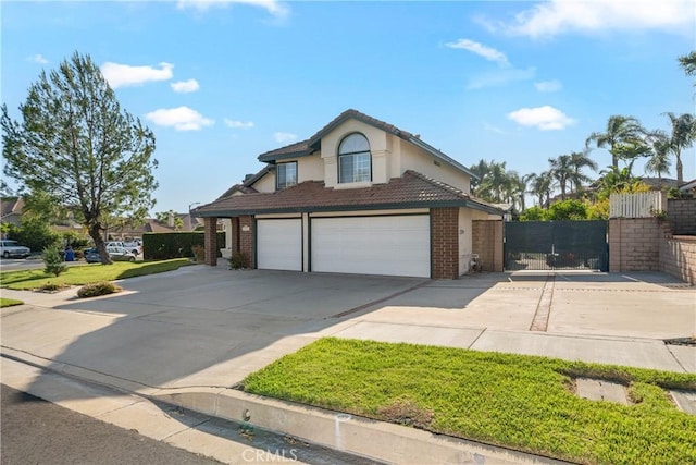 10880 Colusa St, Rancho Cucamonga, CA 91701 - traditional-style home with brick siding, concrete driveway, stucco siding, a garage, and a tile roof