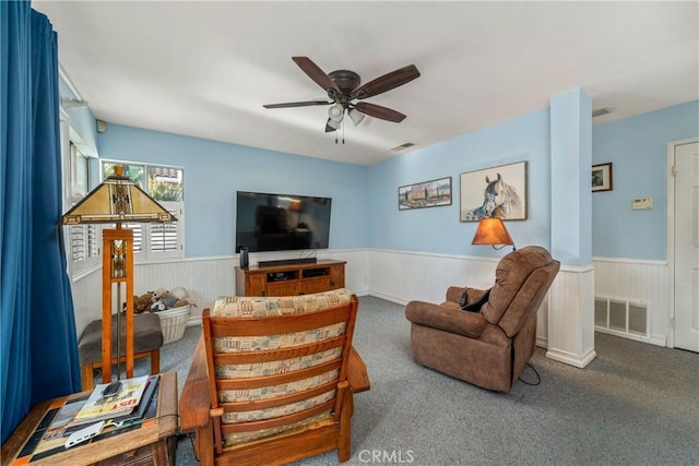 10880 Colusa St, Rancho Cucamonga, CA 91701 - carpeted living area featuring a wainscoted wall and ceiling fan