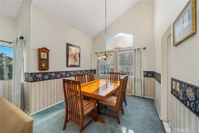 10880 Colusa St, Rancho Cucamonga, CA 91701 - dining space featuring carpet flooring, high vaulted ceiling, a chandelier, a wainscoted wall, and wallpapered walls
