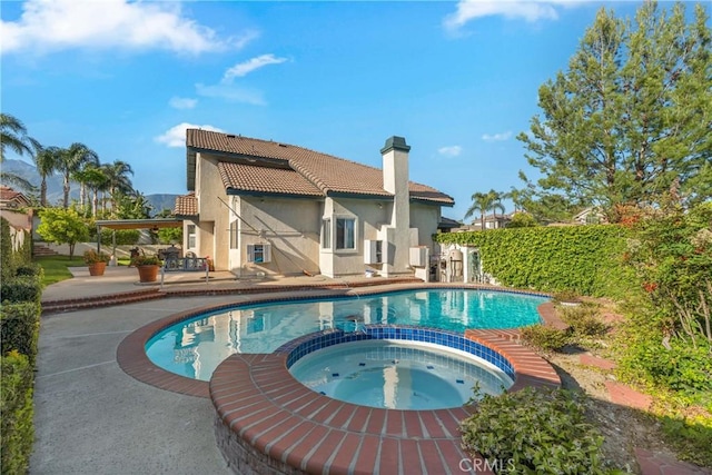 10880 Colusa St, Rancho Cucamonga, CA 91701 - view of swimming pool featuring a patio area and a pool with connected hot tub