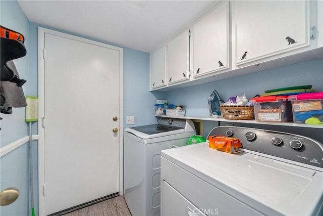 10880 Colusa St, Rancho Cucamonga, CA 91701 - washroom with washer and clothes dryer, cabinet space, and light wood-style floors