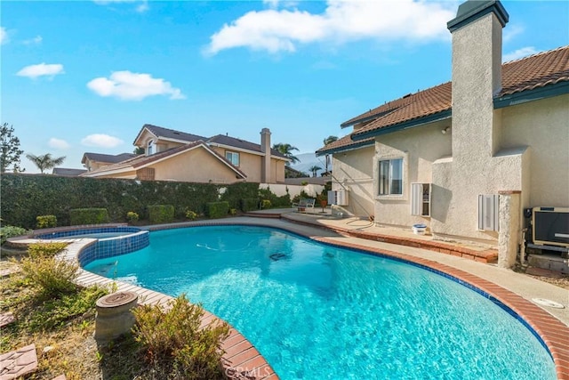 10880 Colusa St, Rancho Cucamonga, CA 91701 - view of swimming pool featuring a fenced backyard, a patio, and a pool with connected hot tub