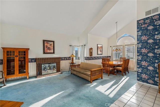 10880 Colusa St, Rancho Cucamonga, CA 91701 - carpeted living area with high vaulted ceiling, tile patterned flooring, baseboards, and a fireplace