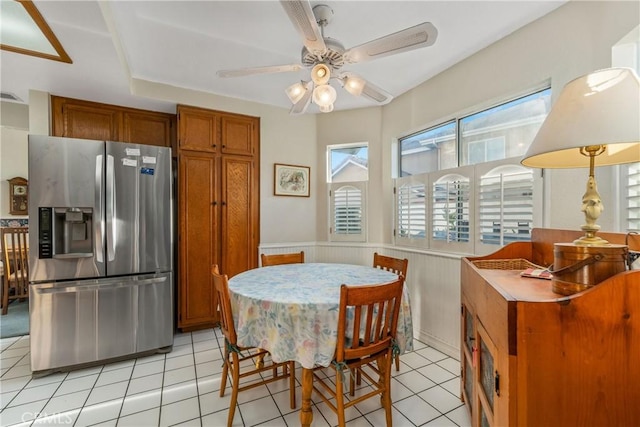10880 Colusa St, Rancho Cucamonga, CA 91701 - dining area featuring a wainscoted wall, a ceiling fan, and light tile patterned flooring