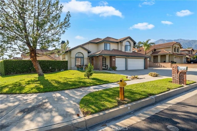 10880 Colusa St, Rancho Cucamonga, CA 91701 - mediterranean / spanish house featuring stucco siding, driveway, a front yard, a garage, and a mountain view