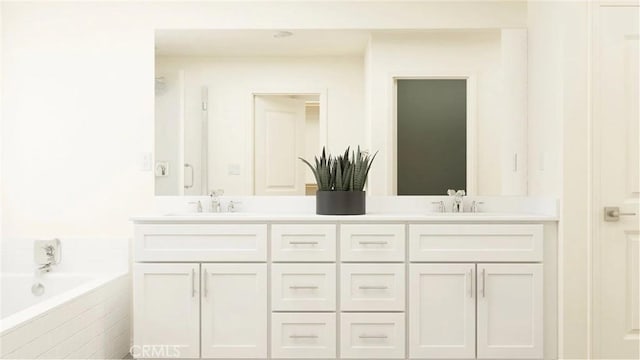 1630 Eagle Rd, Rialto, CA 92376 - bathroom featuring double vanity and a garden tub