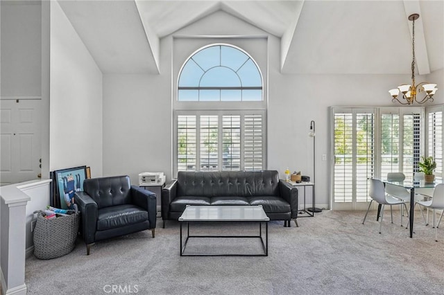 18107 Erik Ct Unit 462, Canyon Country, CA 91387 - carpeted living room featuring a chandelier, healthy amount of natural light, high vaulted ceiling, and baseboards